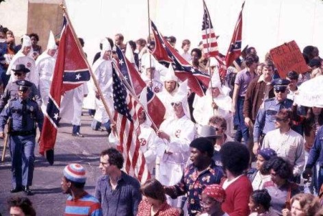KKK leader and members marching past protesters during a downtown rally in Tallahassee, Florida, 1977.  Photo cr: WTSP archive